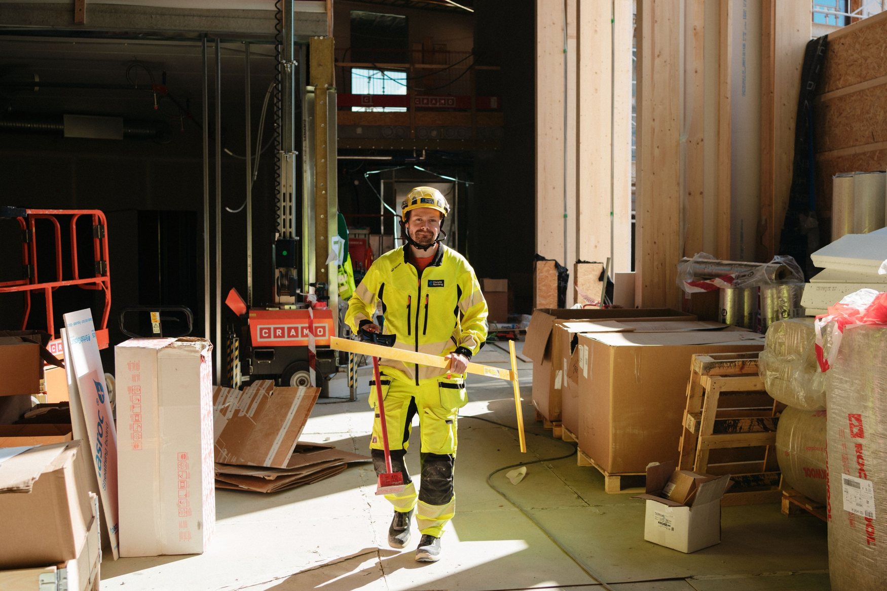 Christie Nordang worker walking through a building under construction
