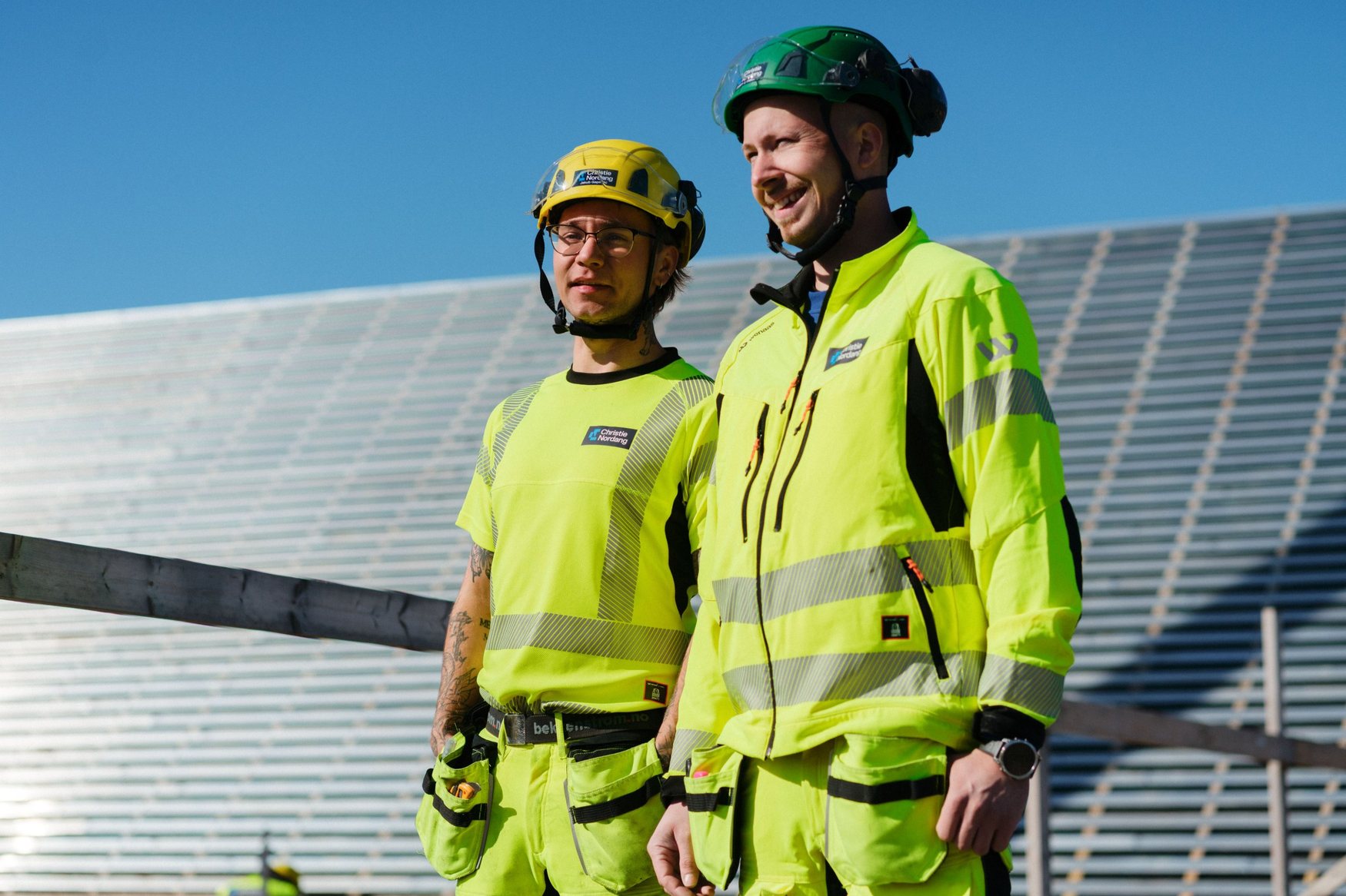 Two Christie Nordang workers in high-visibility clothing on site