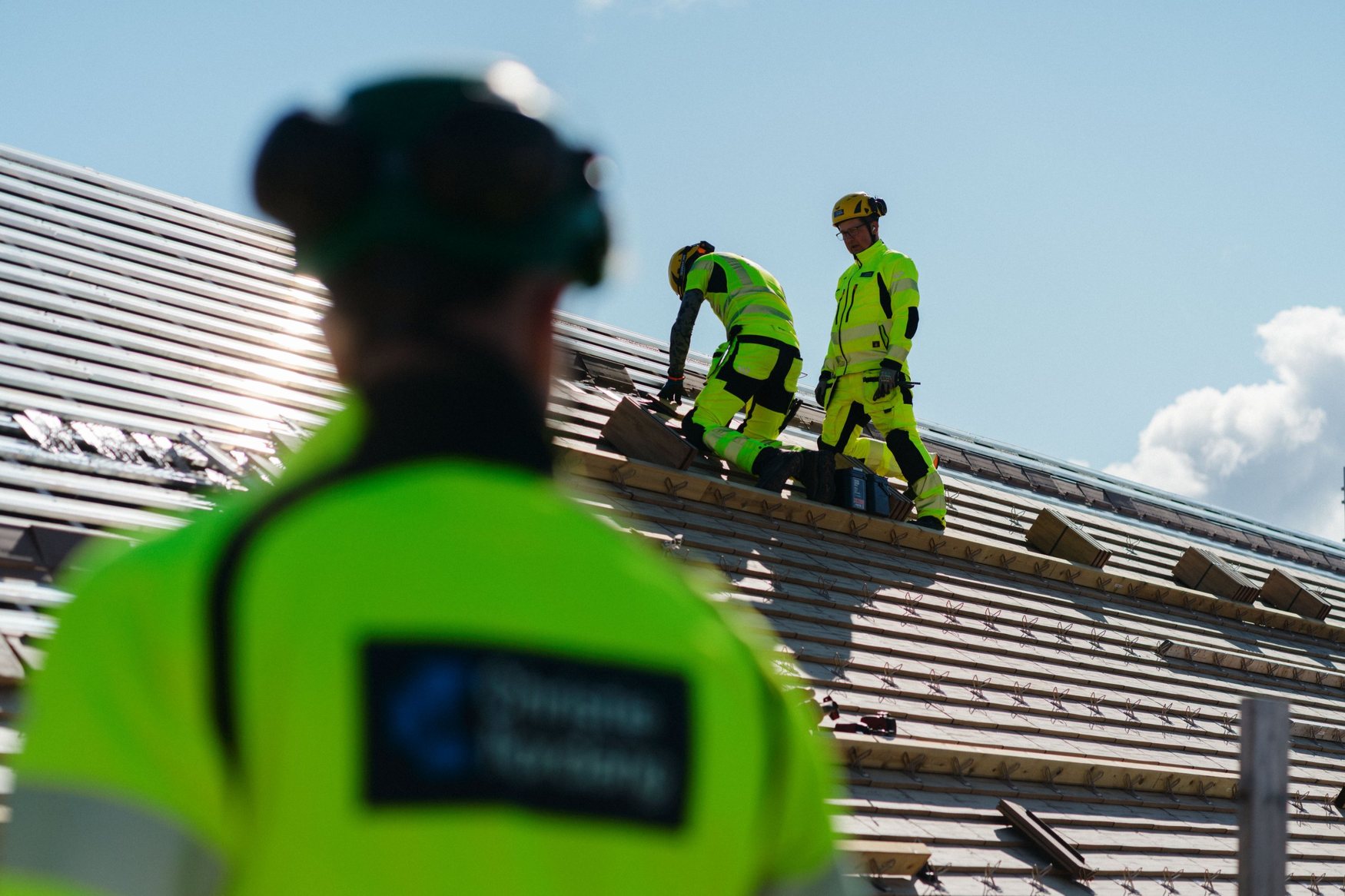 Roofers from Christie Nordang working on a roof