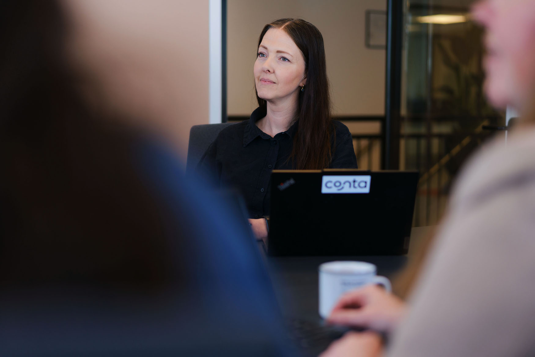 Employees at Conta in the office
