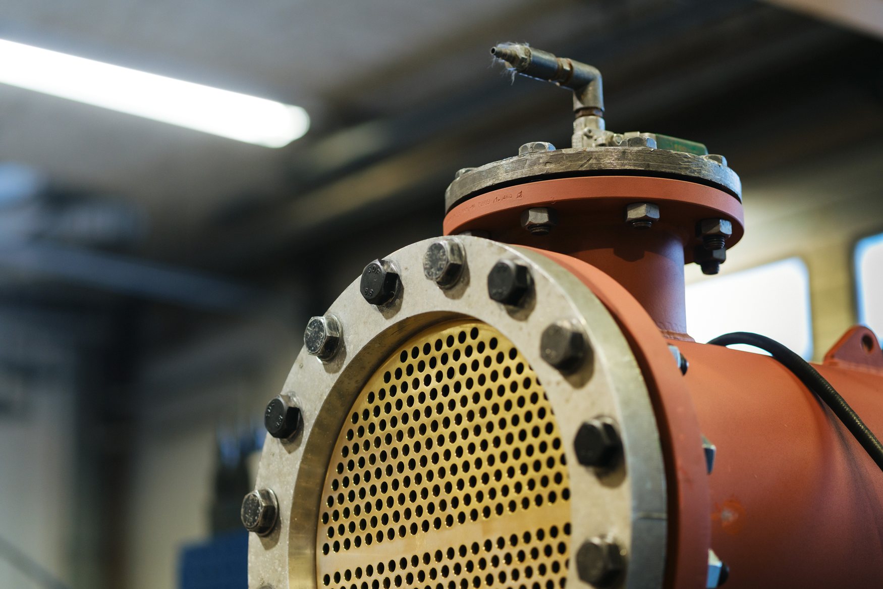 Flanged heat exchanger with brass tube sheet