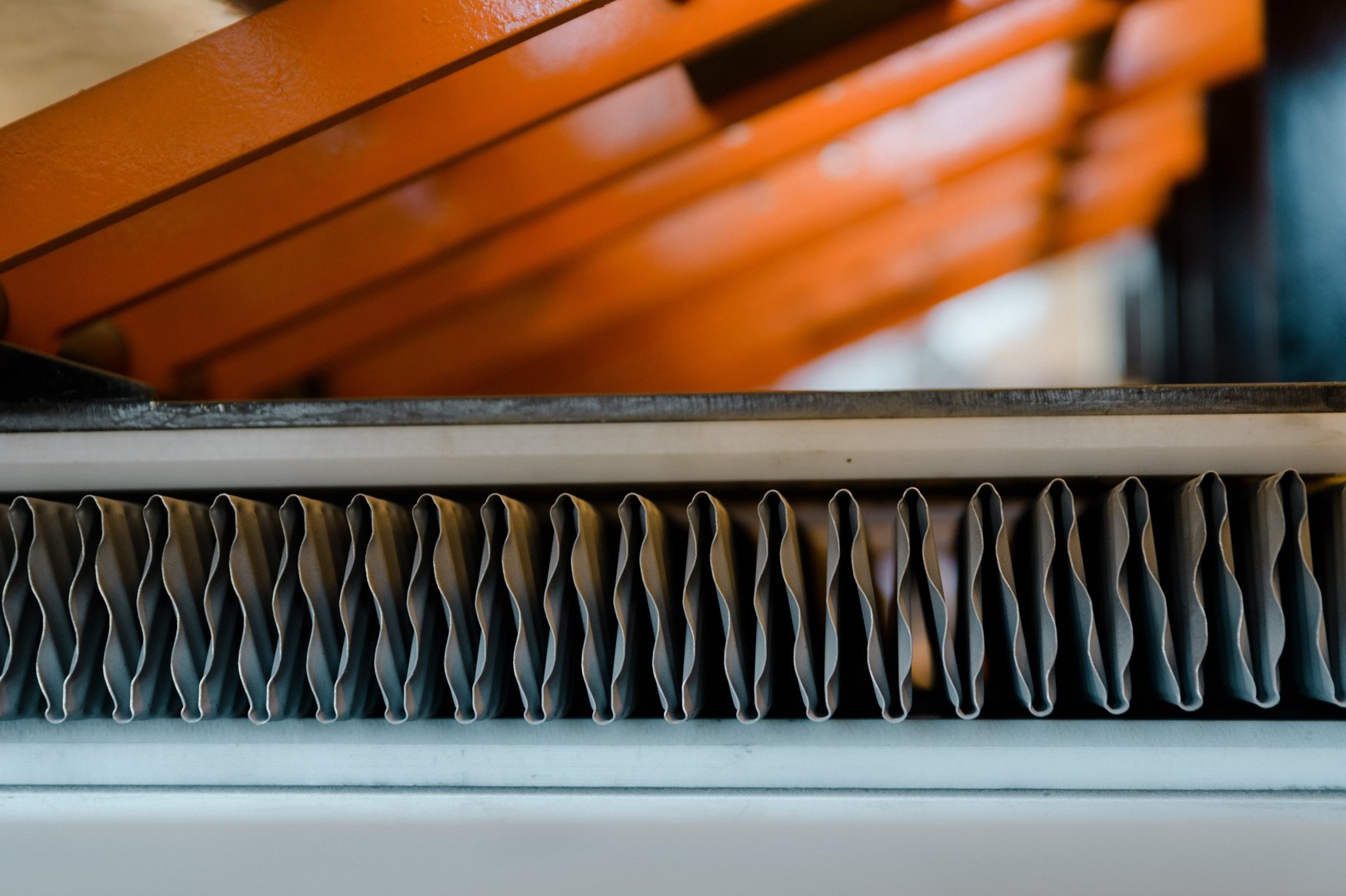 Close-up of corrugated cooling fins in the workshop