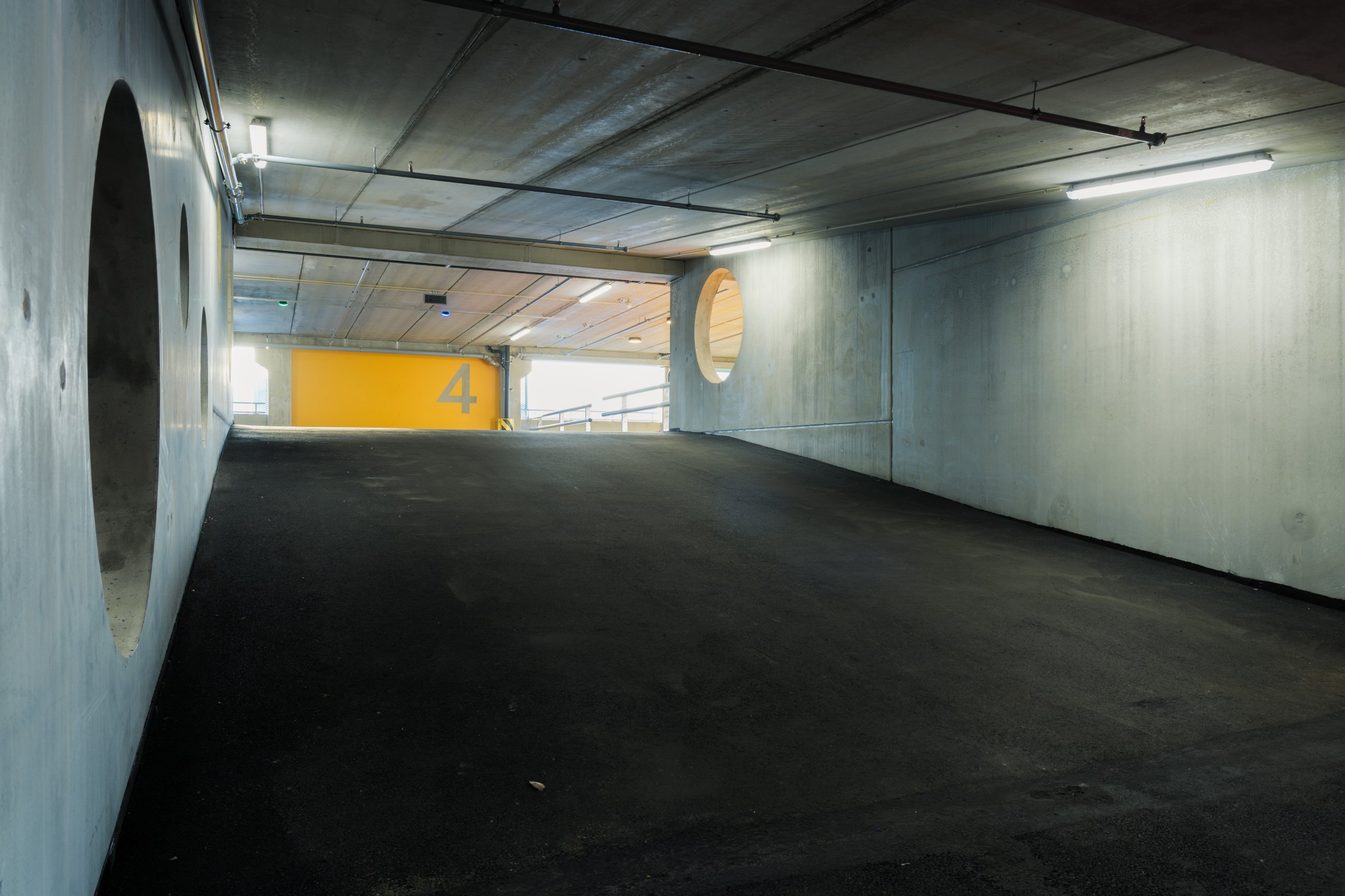 Concrete ramp with round openings leading to level 4